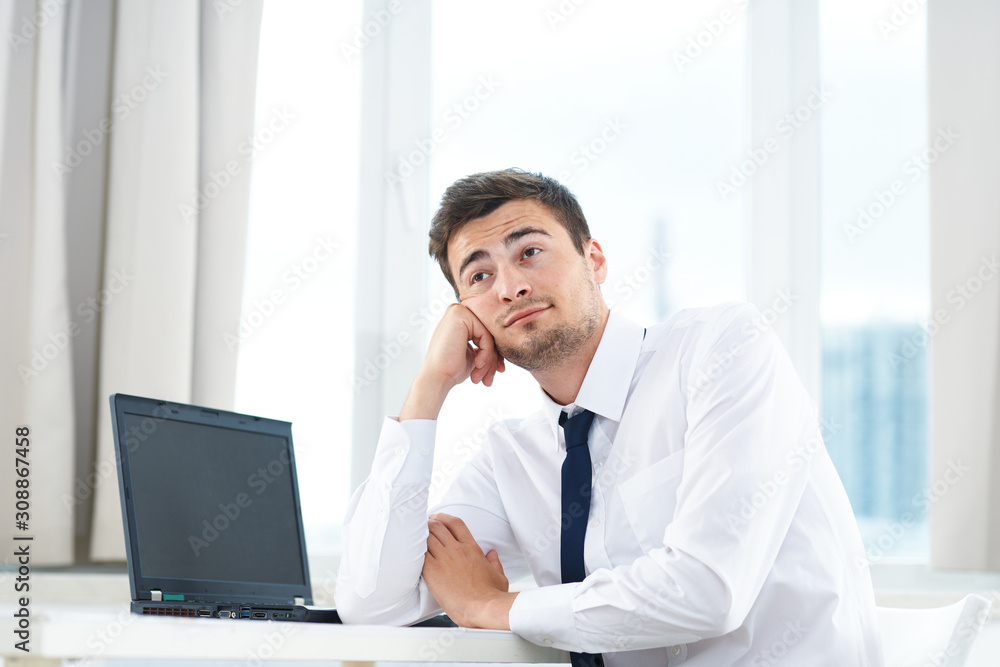 portrait of a businessman working on laptop portrait of a businessman working on laptop