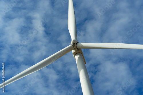 wind turbine and blue sky background. concept clean energy power in nature