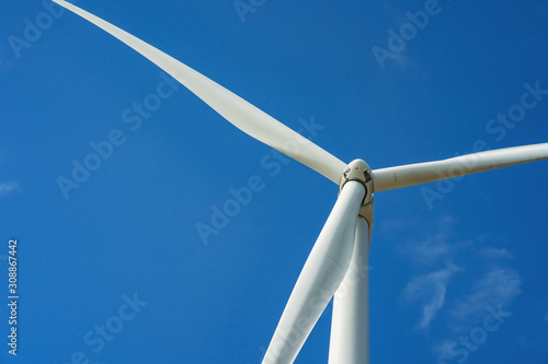 wind turbine and blue sky background. concept clean energy power in nature
