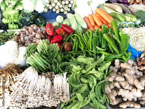 Organic green vegetables sold on market stall