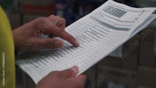 man checks invoices close up