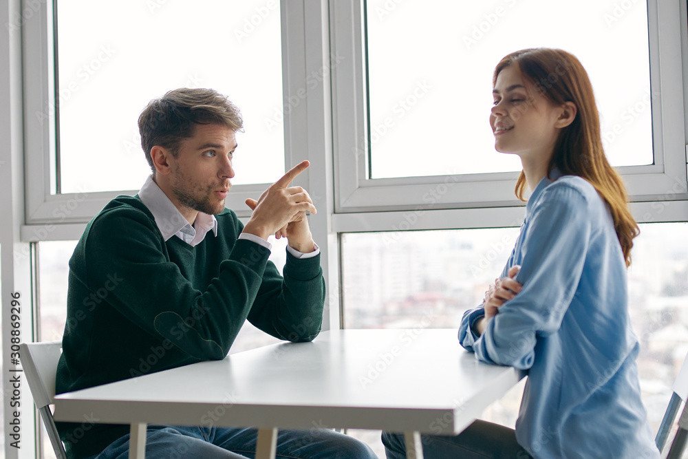 man and woman shaking hands in office man and woman shaking hands in office