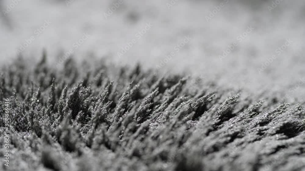 Iron powder under the influence of a magnetic field. Сlose-up. Iron powder under the influence of a magnetic field. Сlose-up.