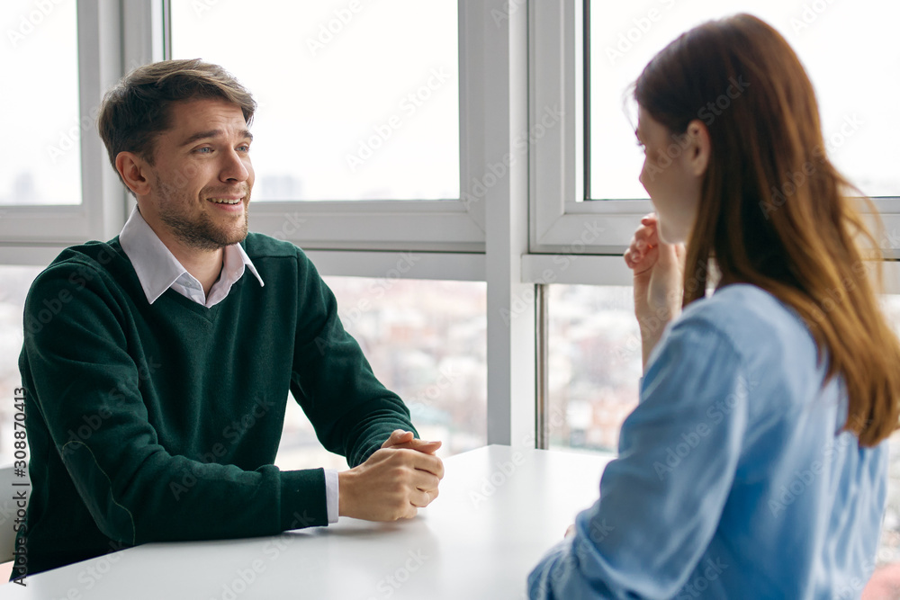man and woman shaking hands in office man and woman shaking hands in office