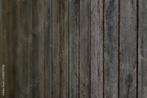 Close up old wooden fence panels. dark tone
