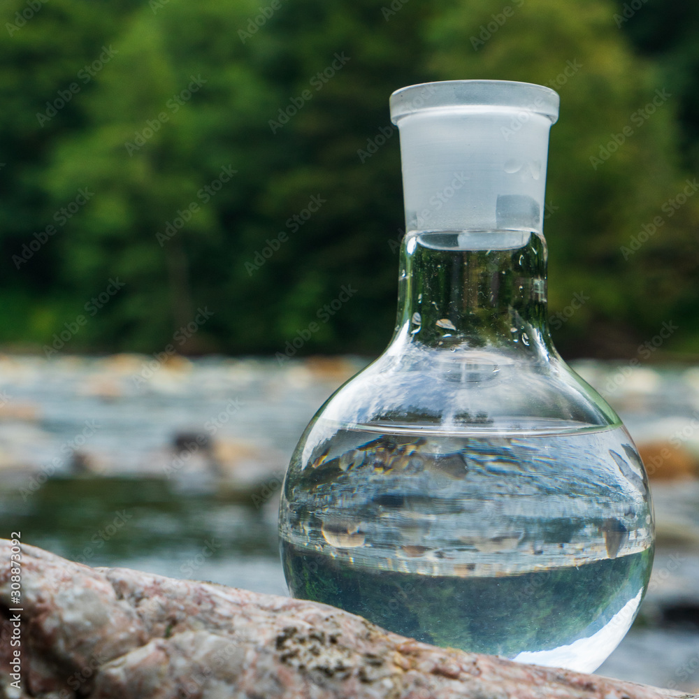 Glass flask with clean drinking water. Glass flask with clean drinking water.