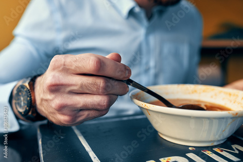 man eating soup