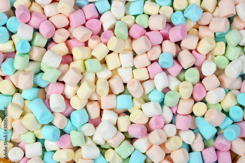 A bunch of small multi-colored Christmas marshmallows backgound