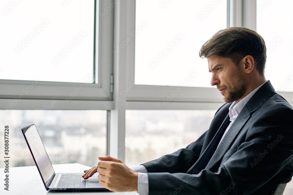 businessman working on laptop in office businessman working on laptop in office