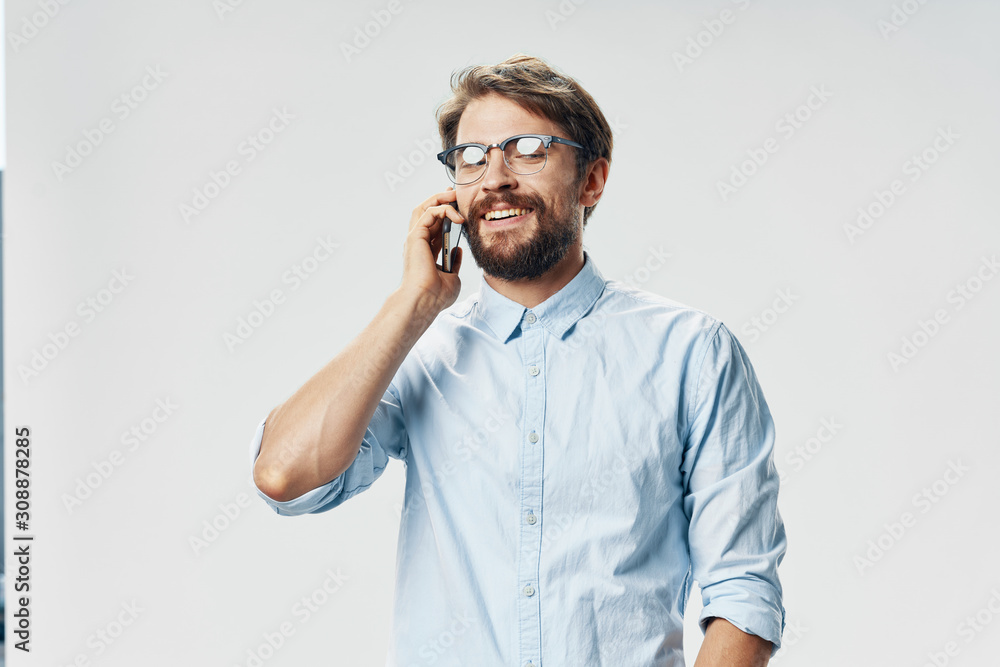 young man talking on the phone isolated on white young man talking on the phone isolated on white