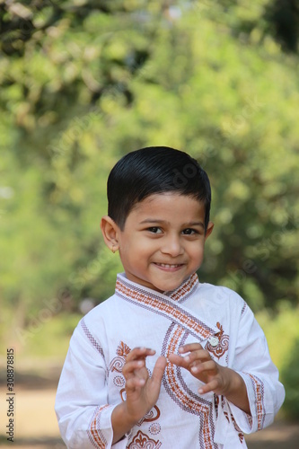Indian little boy in Traditional Wear and Showing multi pal expression 