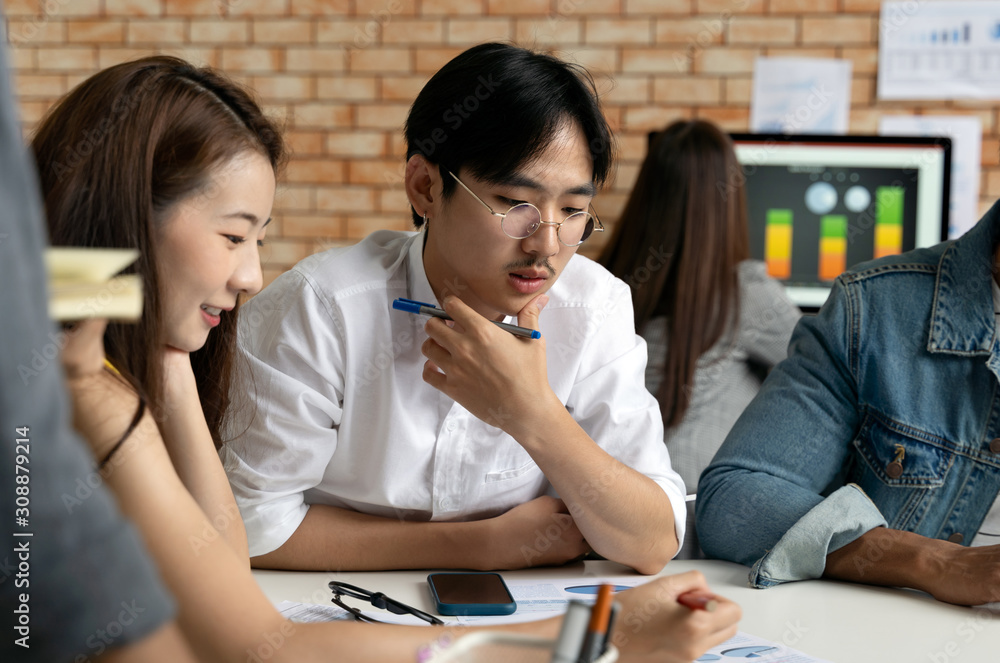 Group of Asian business people team meeting in modern office working design planning and ideas concept Group of Asian business people team meeting in modern office working design planning and ideas concept