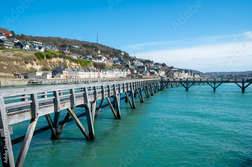 View of the walkway on the pier at the entrance of the Port of Fecamp, Seine-Maritime, Normandy, France, Europe on the coast of Normandy in the English Channel in Spring  photo
