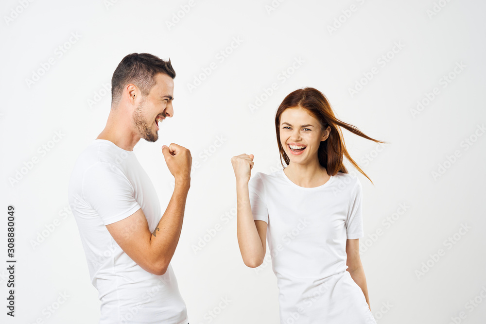 young couple pointing at something young couple pointing at something