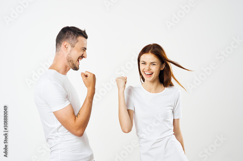 young couple pointing at something