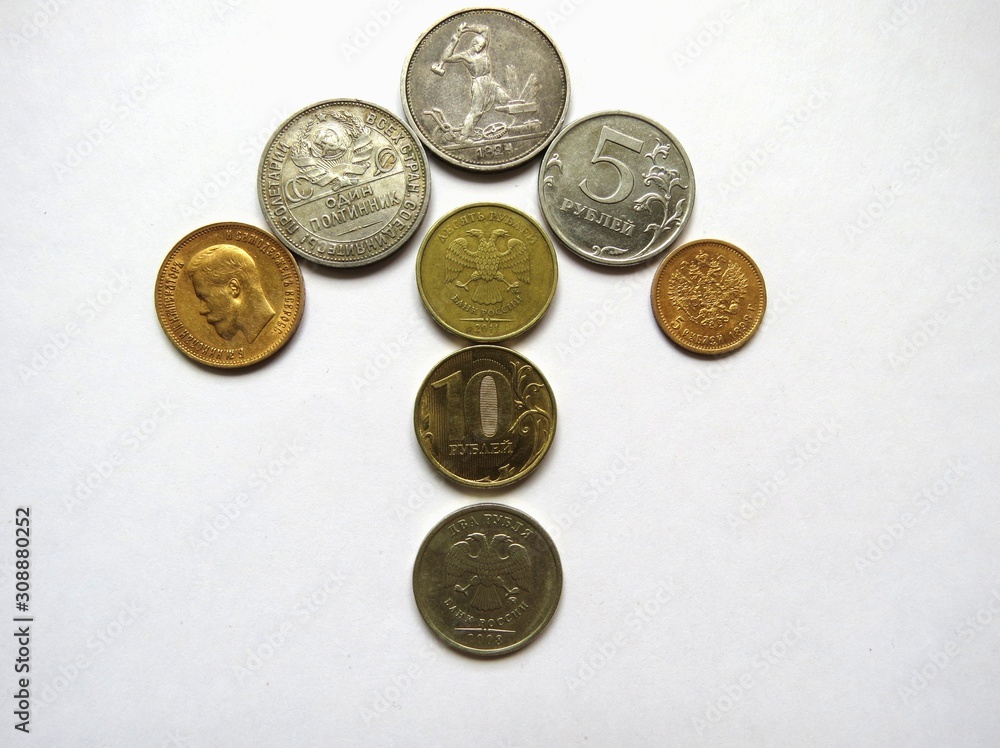 several different ancient coins stacked in the form of arrows indicate a direction on white background stock photo.isolated object several different ancient coins stacked in the form of arrows indicate a direction on white background stock photo.isolated object