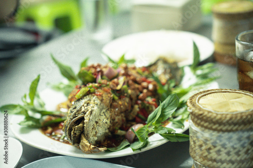 Herbal snakehead fish salad served with sticky rice