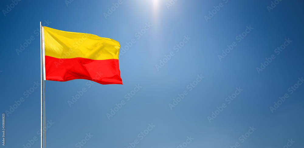 KARNATAKA FLAG FLYING HIGH BLUE SKY BACKGROUND KARNATAKA FLAG FLYING HIGH BLUE SKY BACKGROUND