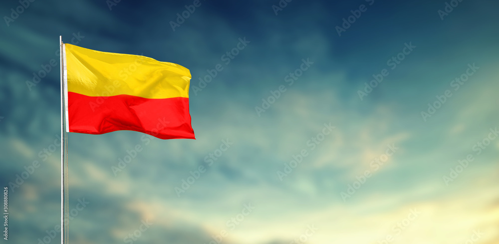 KARNATAKA FLAG FLYING HIGH BLUE SKY BACKGROUND KARNATAKA FLAG FLYING HIGH BLUE SKY BACKGROUND