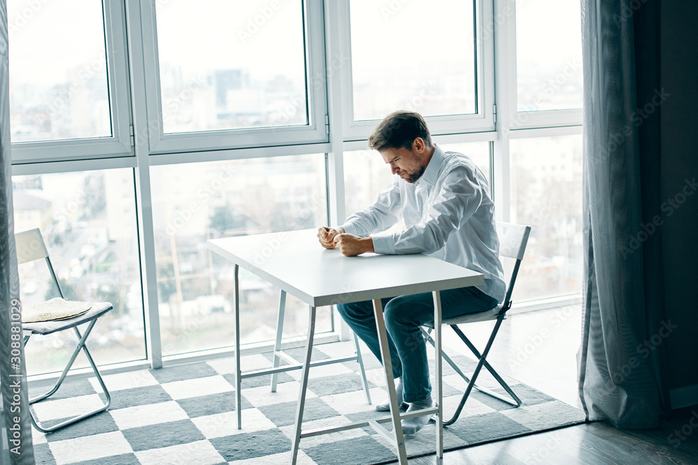 businessman sitting on chair and working on his laptop businessman sitting on chair and working on his laptop
