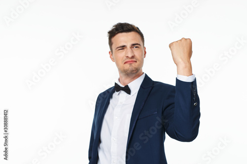 happy businessman with arms raised