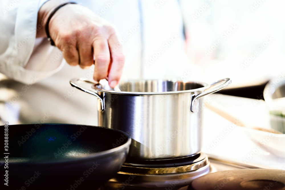 Chef preparing food in the kitchen, chef cooking, Chef decorating dish Chef preparing food in the kitchen, chef cooking, Chef decorating dish