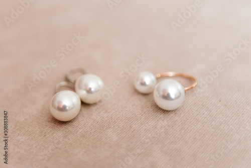 Women's wedding jewelry on a light background, selective focus