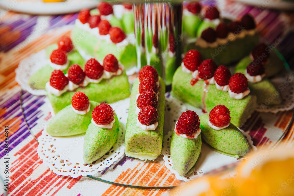 A set of cakes lie on a stand.
