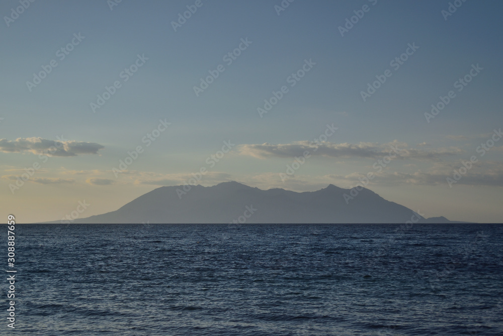 Sunset seascape from Marmaros beach - view of Samothraki - turkish aegean island Gokceada (Imbros) Sunset seascape from Marmaros beach - view of Samothraki - turkish aegean island Gokceada (Imbros)