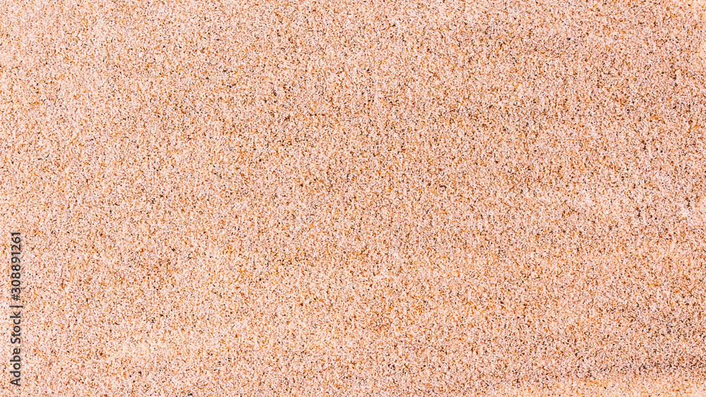 Fototapeta premium Amazing fine sea sand from the ocean. Sand texture background. Banner. Selective focus. Top view.