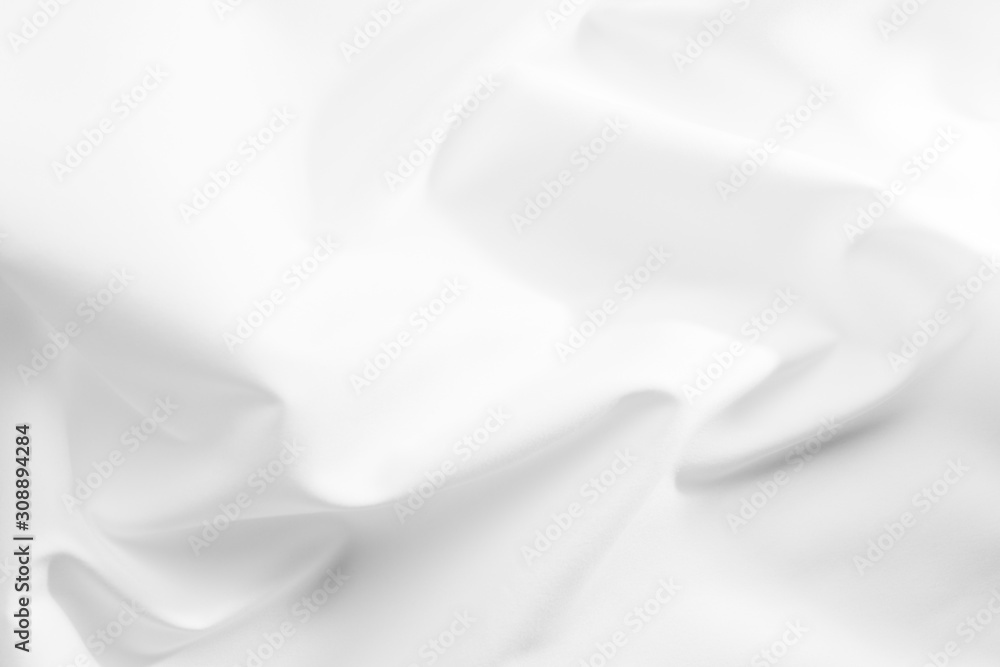 Fototapeta premium Abstract white fabric texture background. Cloth soft wave. Creases of satin, silk, and cotton. 