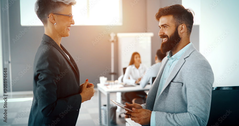 Business colleagues having conversation during coffee break Business colleagues having conversation during coffee break