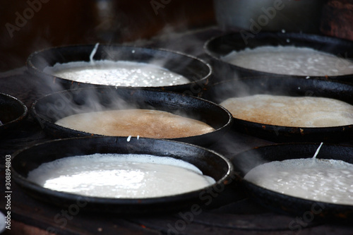 Rural stove. On it in pig-iron frying pans pancakes are fried.