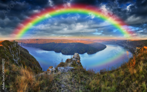 rainbow over the river. canyon of a picturesque river