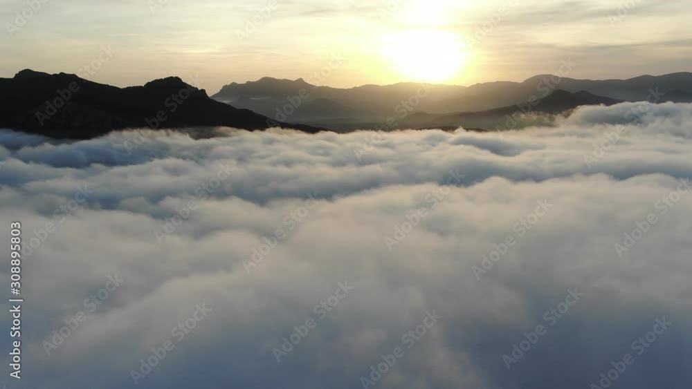 AERIAL NOVEMBER 2019 sunset in the mountains covered in dense fog AERIAL NOVEMBER 2019 sunset in the mountains covered in dense fog