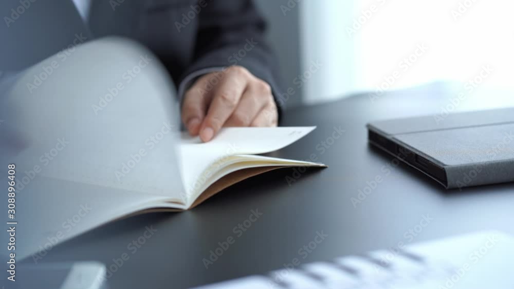 businessman write on notebook on desk in office, conclusion and planning concept businessman write on notebook on desk in office, conclusion and planning concept