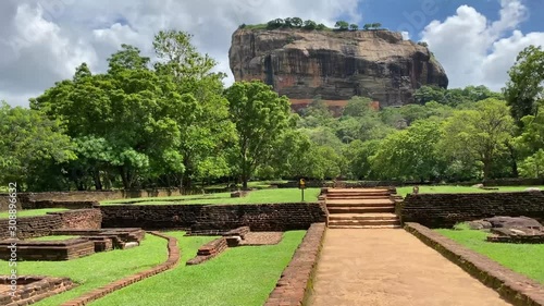 Sigiriya Rock Fortress ancient ruins site in Sri Lanka. Camera moves forward while walking