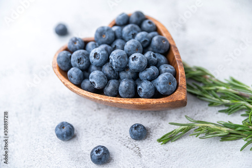 healthy eating antioxidant blueberries in a wooden bowl heart shaped