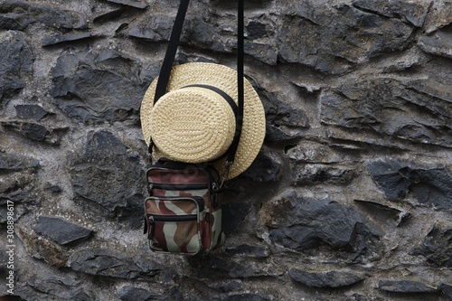 Straw hat on the limestone wall