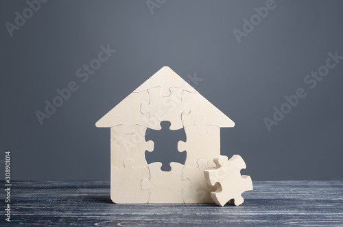 Puzzle house with a missing piece. The acquisition or construction comfortable dream home. Mortgage loan purchase real estate. Arrangement premises repair. Availability and cheapness. Finish building photo