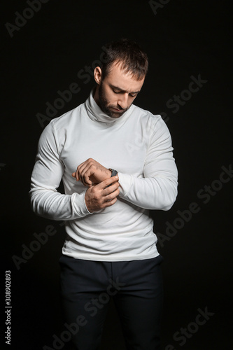 Portrait of young man looki...