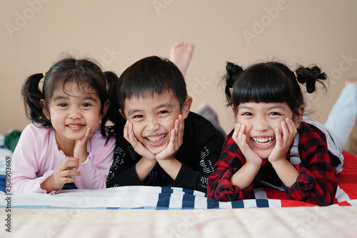 Happy time of Brother and sister having fun together at home. love of children and family concept.