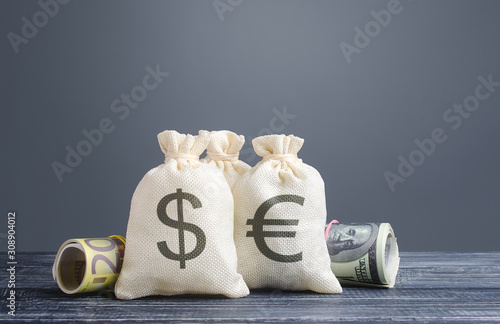 Money bags and world currencies. Capital investment, savings. Economics, lending business. Profit income, dividends payouts. Crowdfunding startups investing. Banking service, budget monetary policy