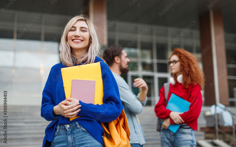 Obraz Cheerful young woman applying to university fototapeta, plakat