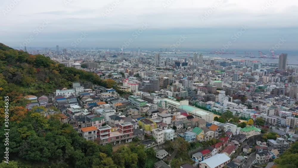 Aerial view of cityscape of Kobe, skyscrapers and other modern buildings skyline of Japanese city, sea on horizon - landscape panorama of Japan from above, Asia Aerial view of cityscape of Kobe, skyscrapers and other modern buildings skyline of Japanese city, sea on horizon - landscape panorama of Japan from above, Asia