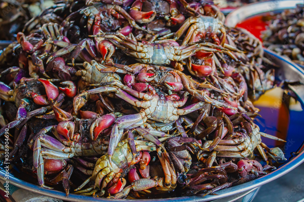 Crab in fish sauce at market street food.