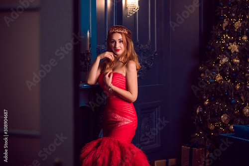Christmas party scene, Woman in gorgeous red feather dress, fashionable concept