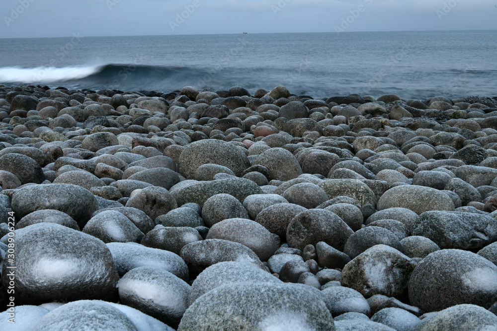 sea beach with stones like big eggs in the arctic sea beach with stones like big eggs in the arctic