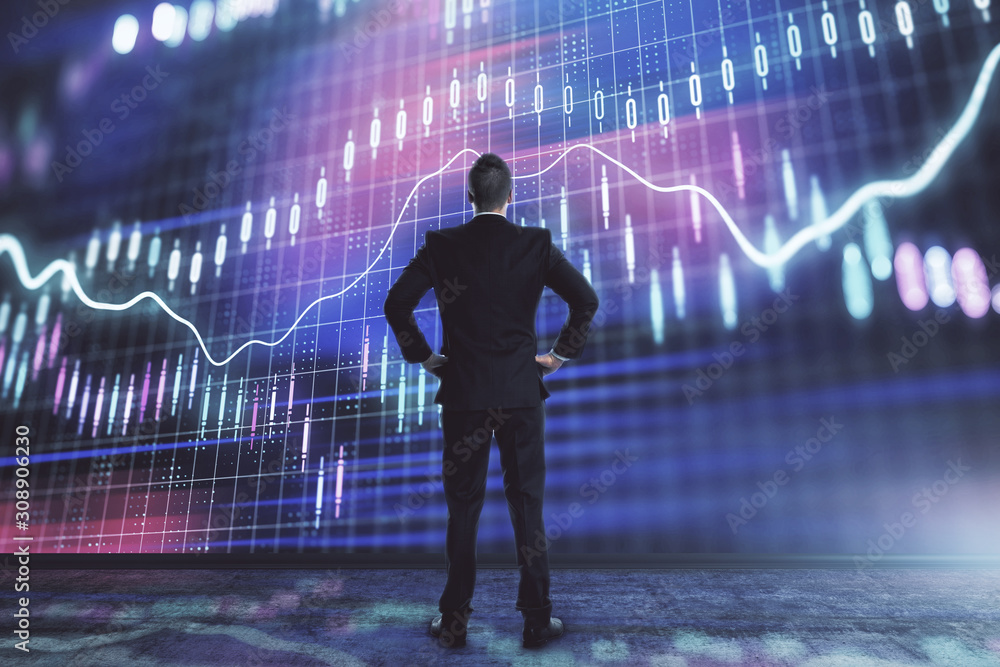 Businessman and forex graph hologram. Double exposure. Concept of financial education and analysis Businessman and forex graph hologram. Double exposure. Concept of financial education and analysis