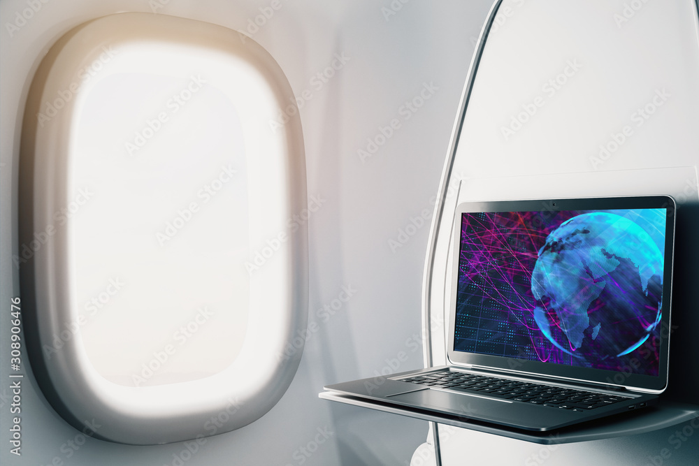 Laptop closeup inside airplane with world map on screen. International ...